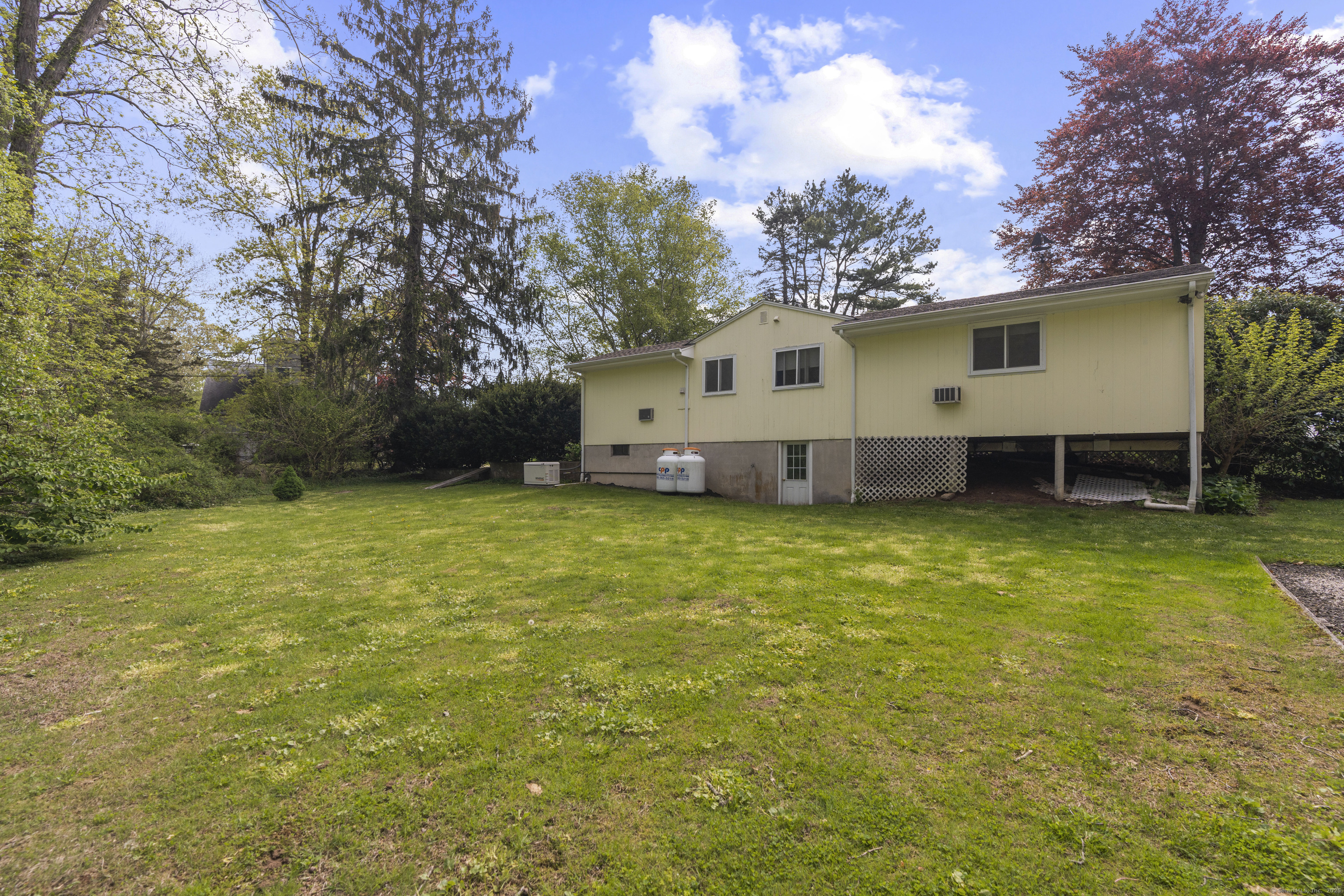 55 Harbor View Road Guilford, CT 06437 - Photo 28 of 38 a view of a house with a backyard