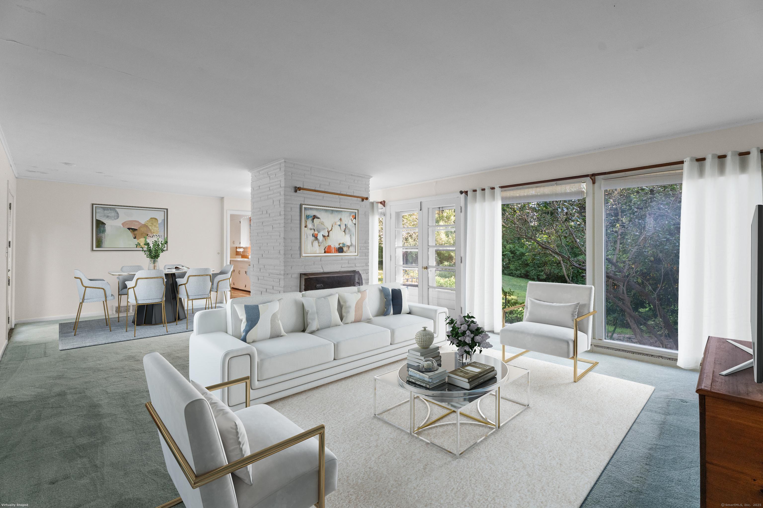 55 Harbor View Road Guilford, CT 06437 - Photo 5 of 38 a living room with furniture and a large window