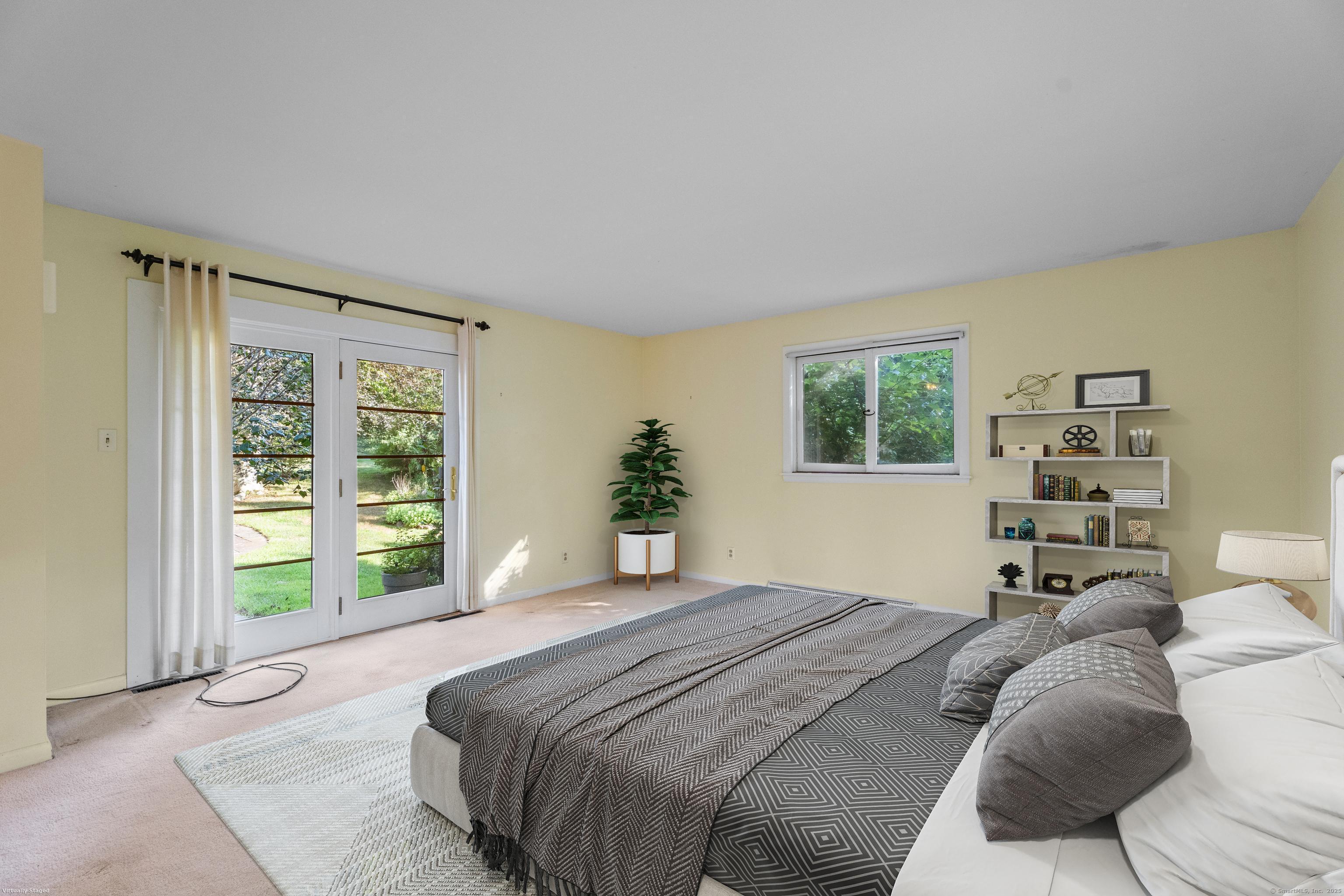 55 Harbor View Road Guilford, CT 06437 - Photo 9 of 38 a bedroom with a large bed and a window