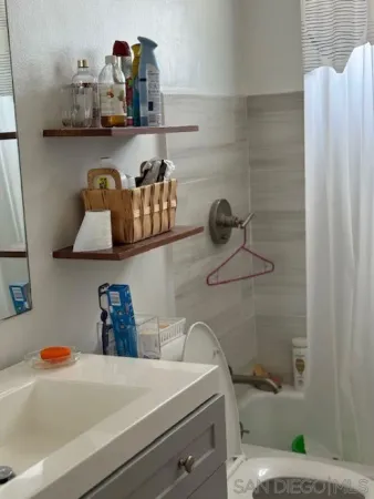 a bathroom with a bathtub and a sink