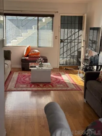 a living room with furniture window and a table