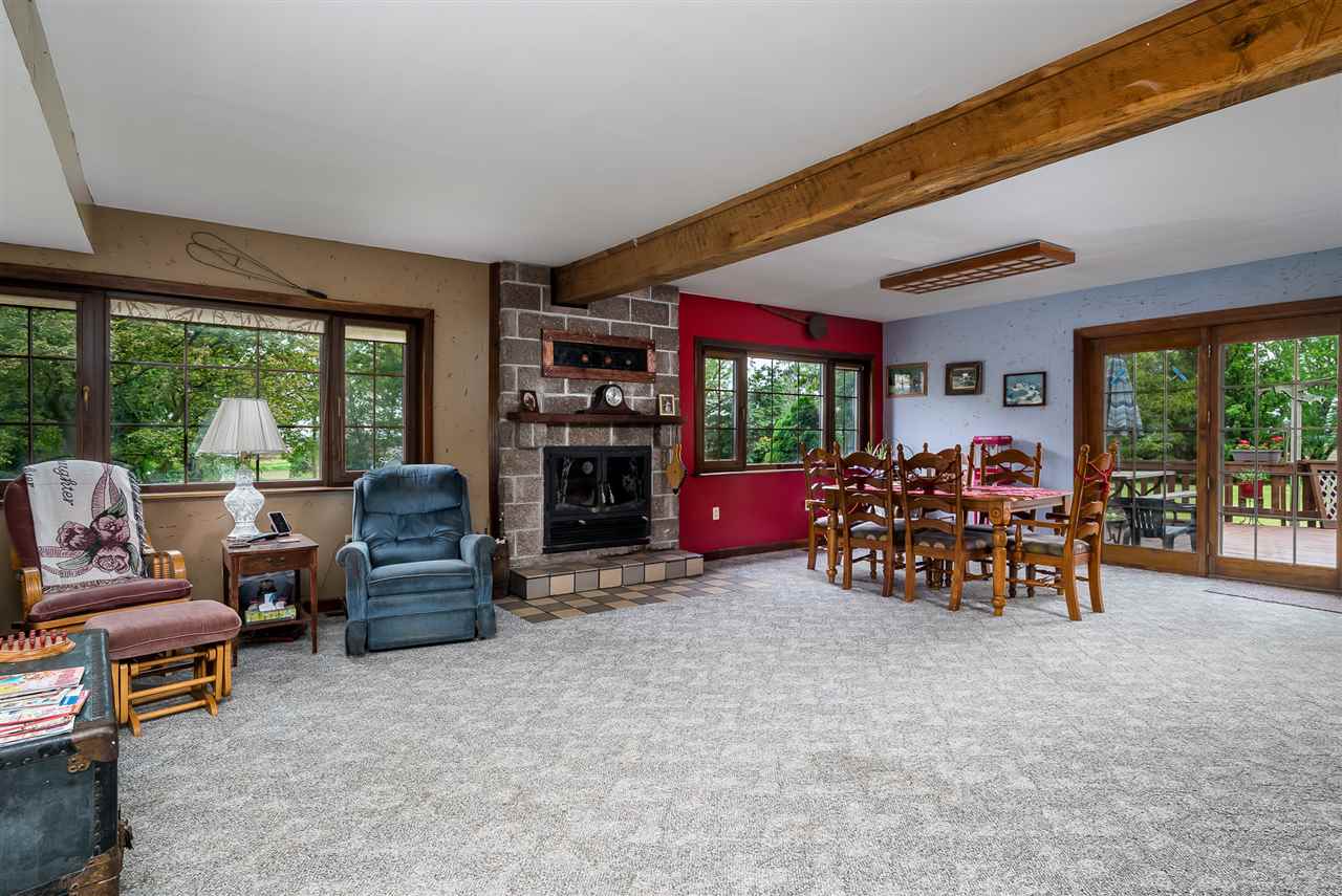 15666 East Bethel Road Rochelle, IL 61068 - Photo 15 of 22 a view of a livingroom with furniture and a garden