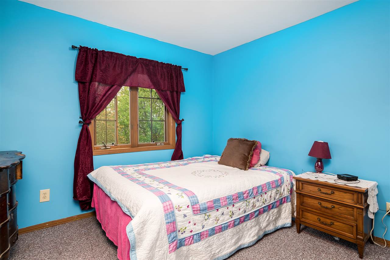 15666 East Bethel Road Rochelle, IL 61068 - Photo 20 of 22 a bedroom with a bed and window