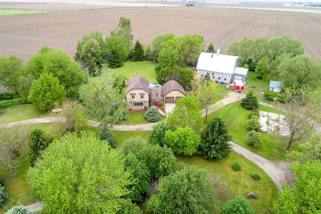 15666 East Bethel Road Rochelle, IL 61068 - Photo 2 of 22 a view of a house with a yard and lake view