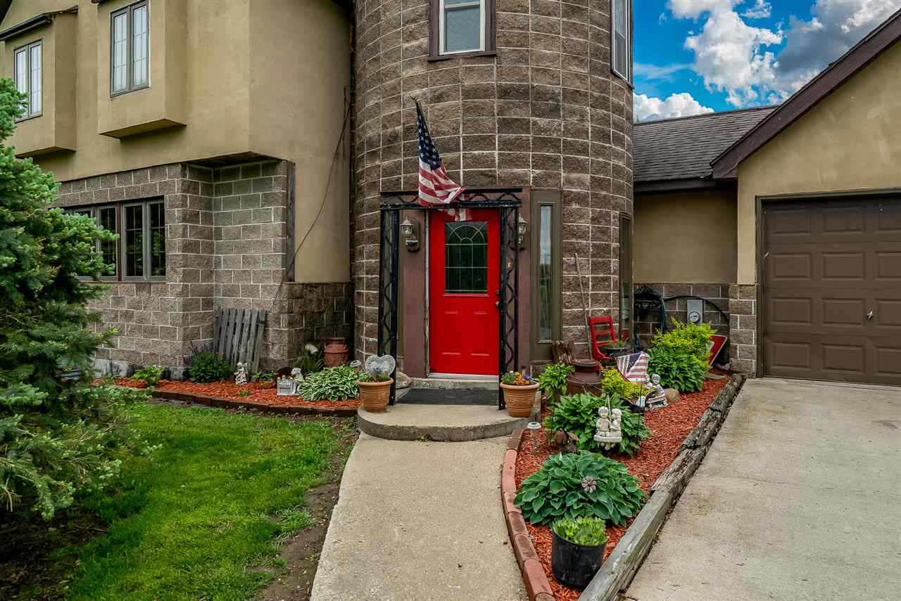 15666 East Bethel Road Rochelle, IL 61068 - Photo 6 of 22 a view of a house with potted plants