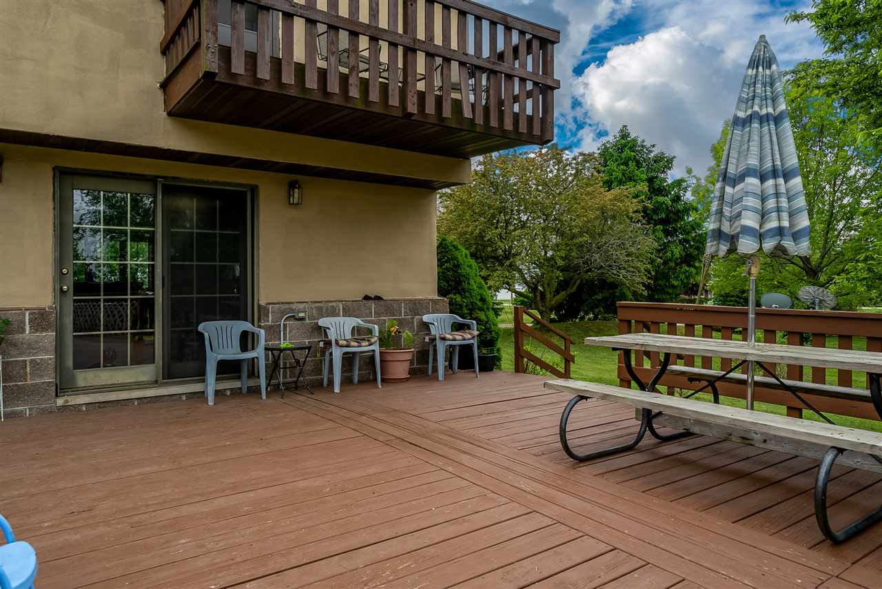 15666 East Bethel Road Rochelle, IL 61068 - Photo 9 of 22 a view of a chairs with a deck