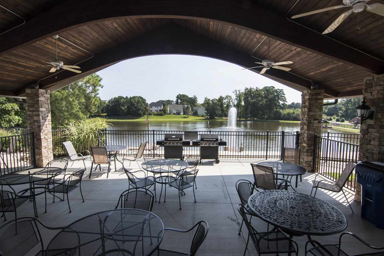 5305 Orabelle Court Raleigh, NC 27606 - Photo 29 of 30 Clubhouse seating features lake views