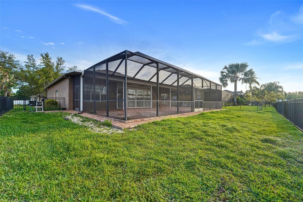 19111 Fern Meadow Loop Lutz, FL 33558 - Photo 13 of 41 a view of a house with a yard and a garden