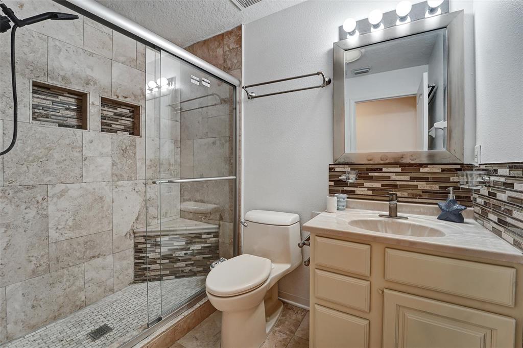 19111 Fern Meadow Loop Lutz, FL 33558 - Photo 22 of 41 a bathroom with a sink a toilet and shower