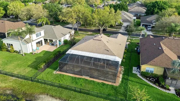 an aerial view of a house with a yard