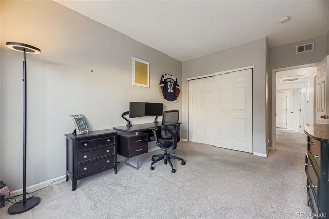 a view of a workspace with furniture