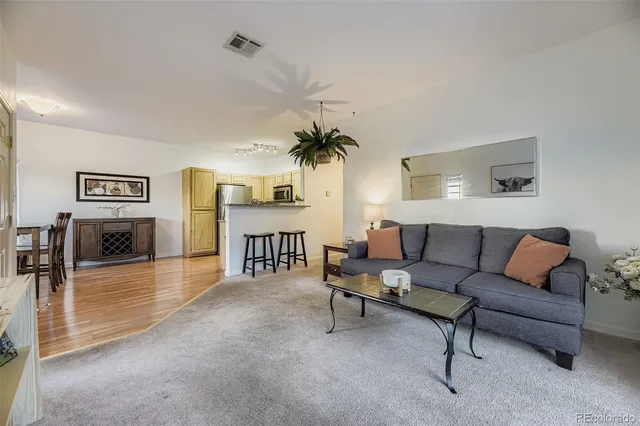 a living room with furniture and a table