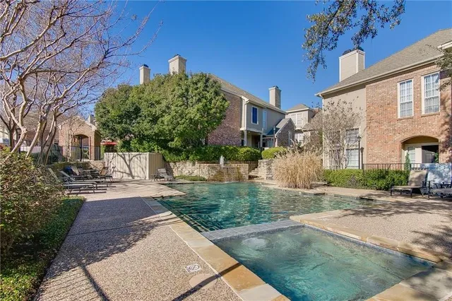 a view of a street with a building in the background