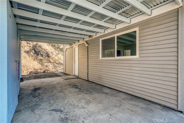 a view of a backyard with a large tree