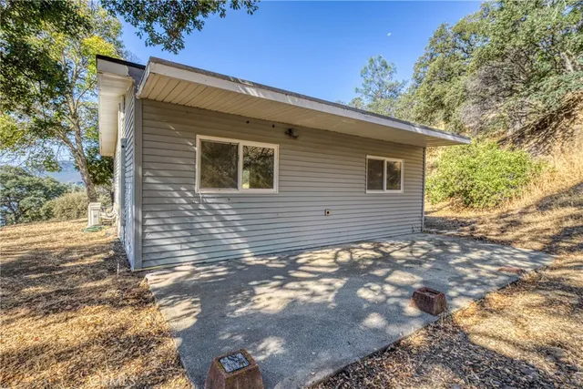 a view of a backyard of the house