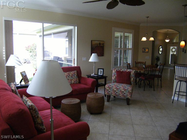 12405 Rock Ridge Lane Fort Myers, FL 33913 - Photo 13 of 23 a living room with furniture and a large window