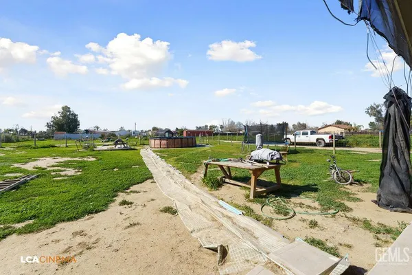 a view of a garden with sitting area