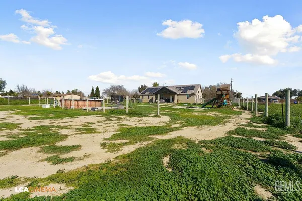 a view of a house with a big yard
