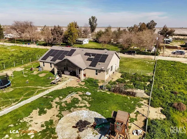 a view of a lake with a yard