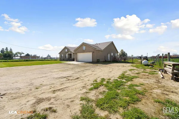 a view of a lake with a house in the background