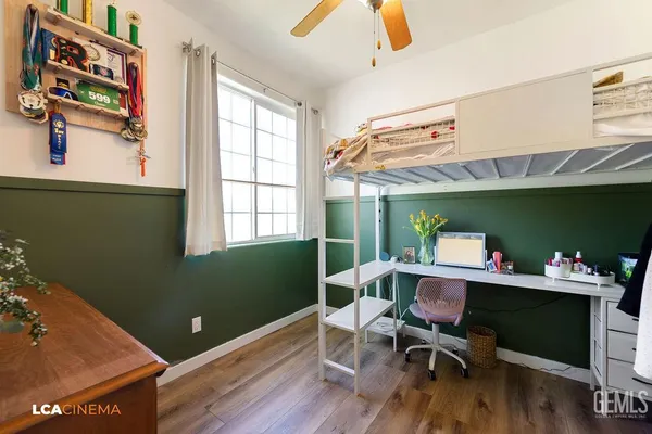 a workspace with furniture hardwood and a window