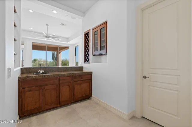 a spacious bathroom with a double vanity sink a large mirror and a shower