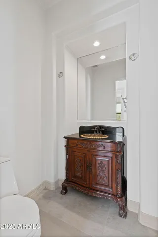 a large bathroom with a large tub and sink