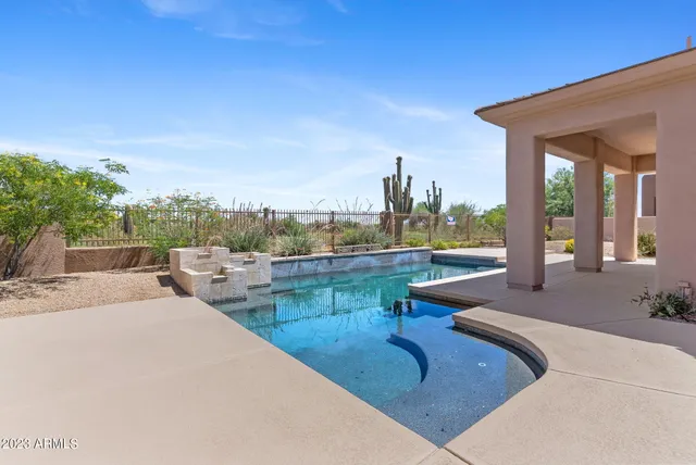 an aerial view of residential house with outdoor space and river