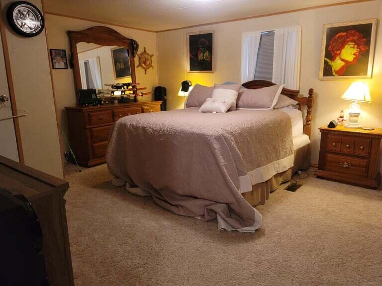 722 Hunt Valley Road Rocky Mount, VA 24151 - Photo 16 of 23 a bed room with a bed and a television