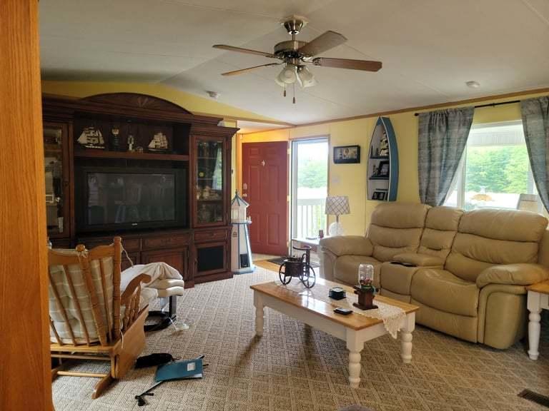722 Hunt Valley Road Rocky Mount, VA 24151 - Photo 4 of 23 a living room with furniture a flat screen tv and a window