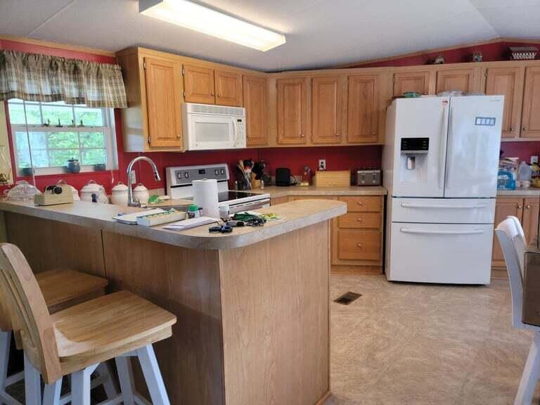722 Hunt Valley Road Rocky Mount, VA 24151 - Photo 5 of 23 a kitchen with a sink appliances and cabinets