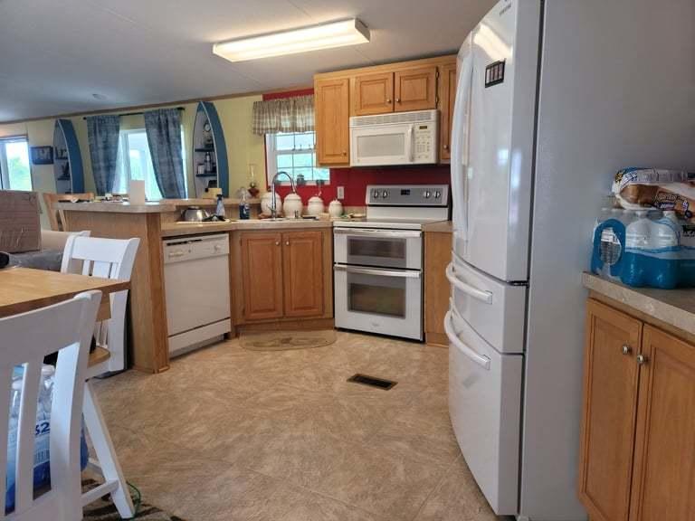722 Hunt Valley Road Rocky Mount, VA 24151 - Photo 6 of 23 a kitchen with cabinets and wooden floor