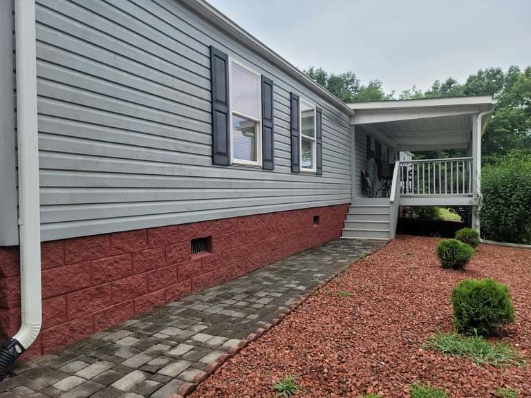 722 Hunt Valley Road Rocky Mount, VA 24151 - Photo 9 of 23 a front view of a house with balcony