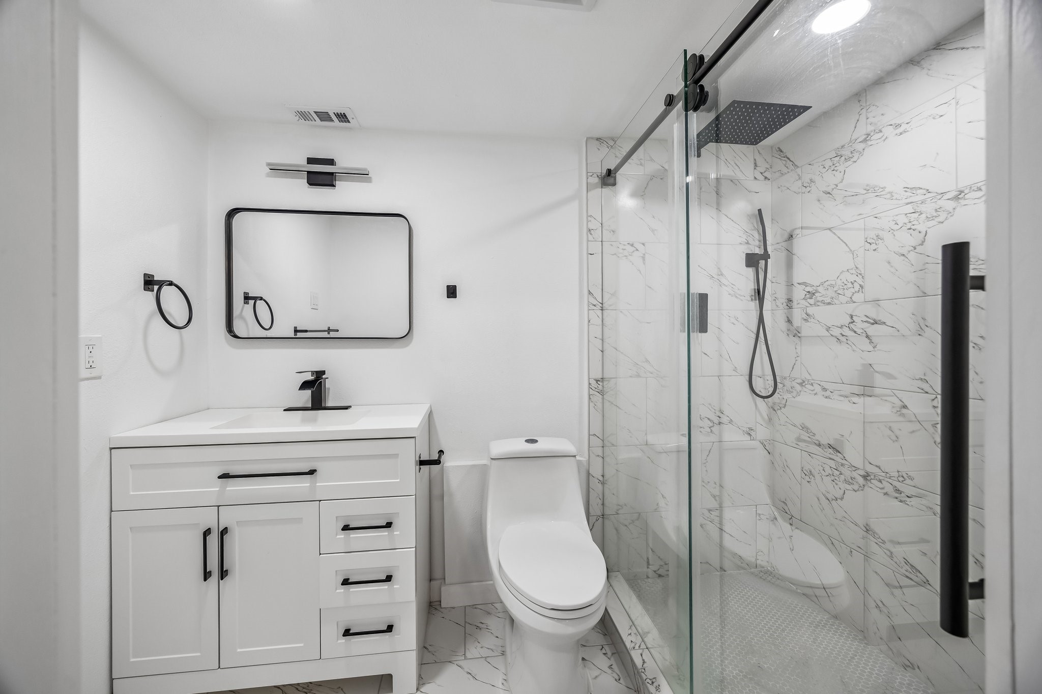 23319 Whispering Willow Drive Spring, TX 77373 - Photo 4 of 31 Primary bathroom with extended shower and Matte Black Rain Shower System with Handheld, Rain Shower Head, Shower Faucet Set and custom frameless shower door.