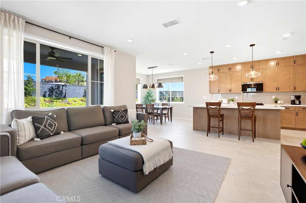 1341 Roots Way Rancho Mission Viejo, CA 92694 - Photo 13 of 75 a living room with furniture and a large window