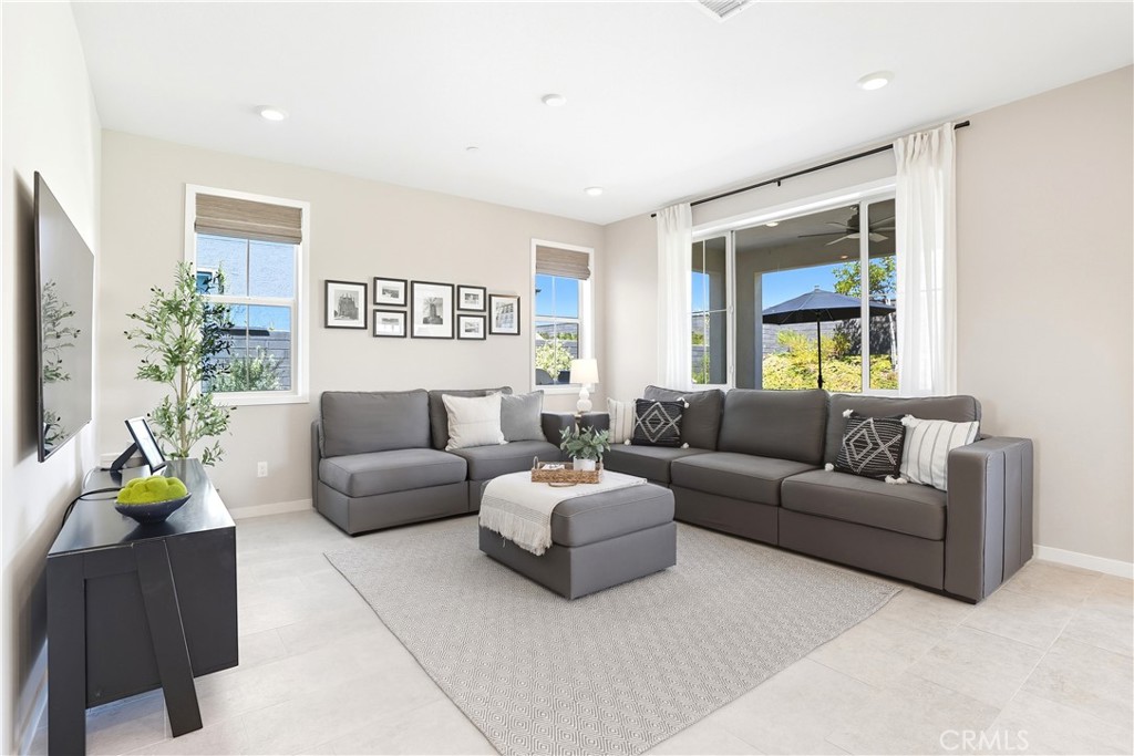 1341 Roots Way Rancho Mission Viejo, CA 92694 - Photo 20 of 75 a living room with furniture and a wooden floor