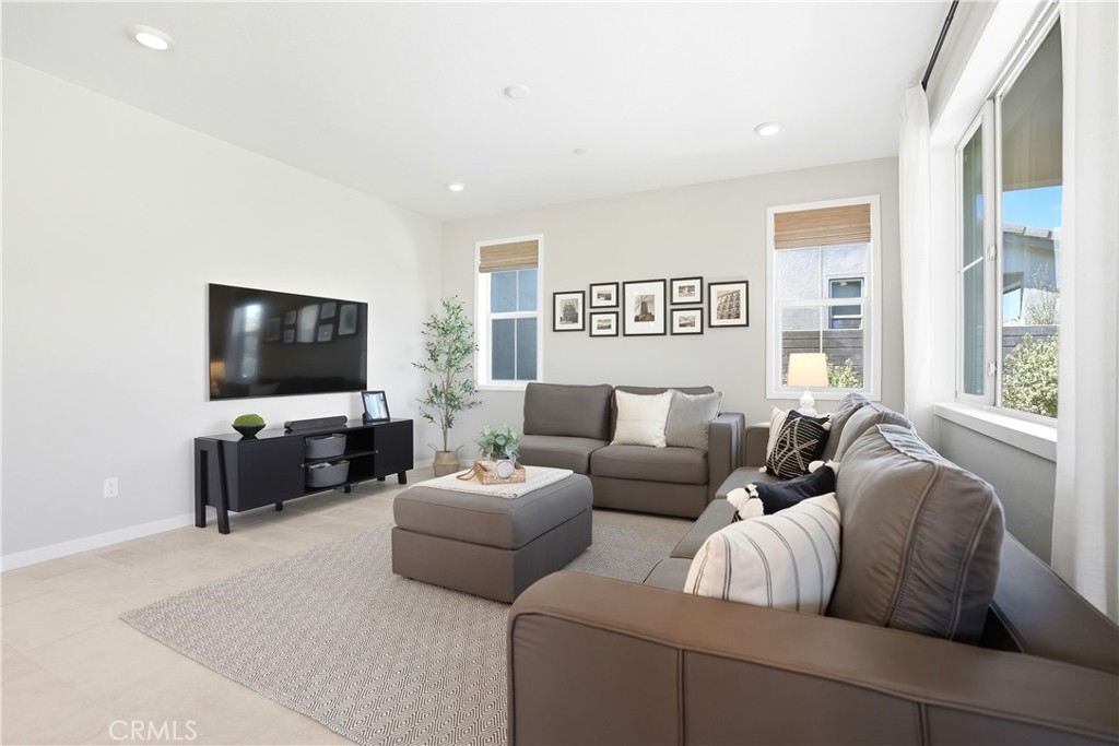 1341 Roots Way Rancho Mission Viejo, CA 92694 - Photo 21 of 75 a living room with furniture and a flat screen tv
