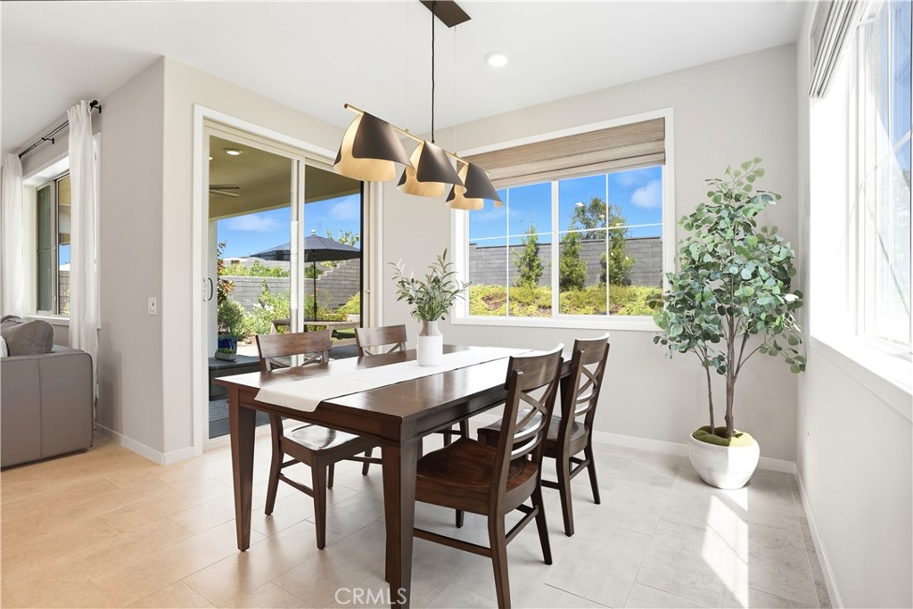 1341 Roots Way Rancho Mission Viejo, CA 92694 - Photo 23 of 75 a view of a dining room with furniture window and wooden floor
