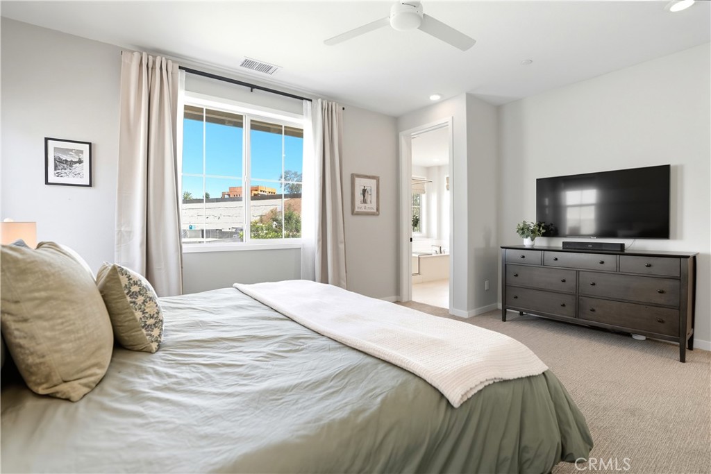 1341 Roots Way Rancho Mission Viejo, CA 92694 - Photo 27 of 75 a bedroom with a bed and a flat screen tv in it