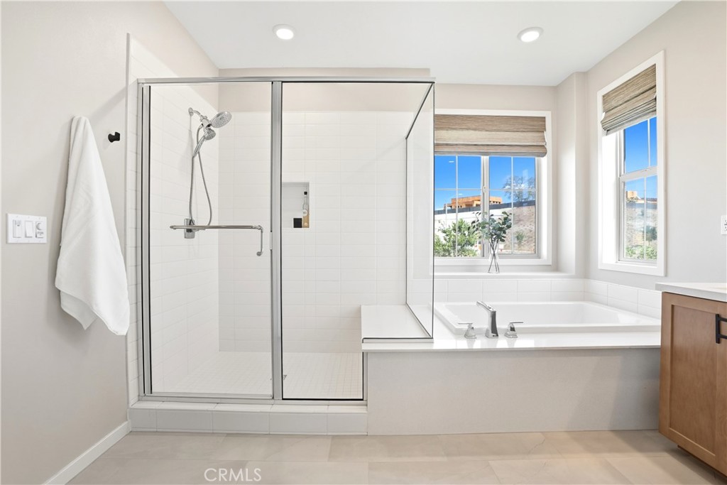1341 Roots Way Rancho Mission Viejo, CA 92694 - Photo 29 of 75 a bathroom with a bathtub and a shower