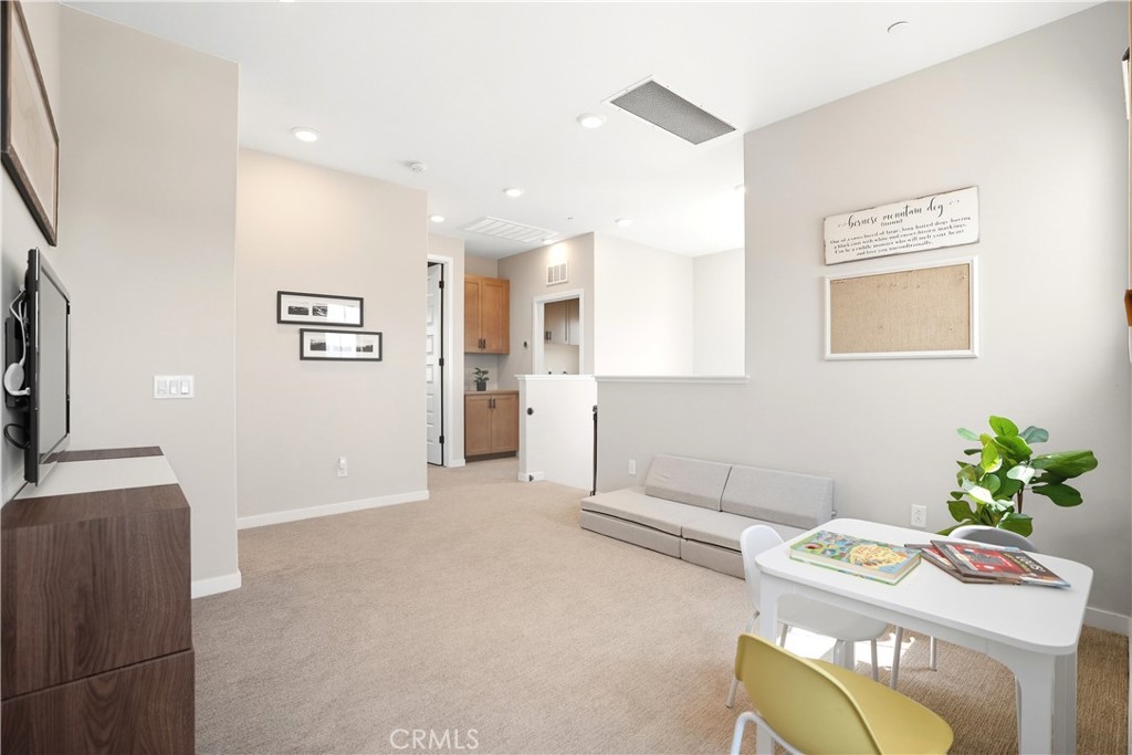 1341 Roots Way Rancho Mission Viejo, CA 92694 - Photo 34 of 75 a living room with furniture and a table