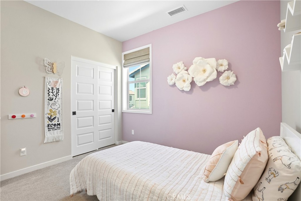 1341 Roots Way Rancho Mission Viejo, CA 92694 - Photo 36 of 75 a bedroom with a bed and a window