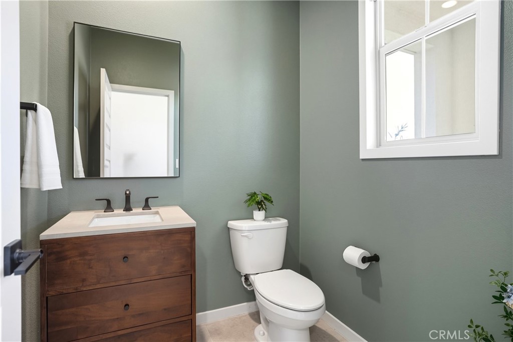 1341 Roots Way Rancho Mission Viejo, CA 92694 - Photo 43 of 75 a bathroom with a toilet sink and mirror