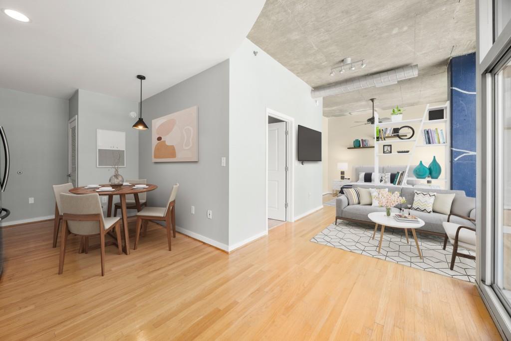 923 Peachtree Street Northeast, Unit 932 Atlanta, GA 30309 - Photo 2 of 69 a living room with furniture and wooden floor