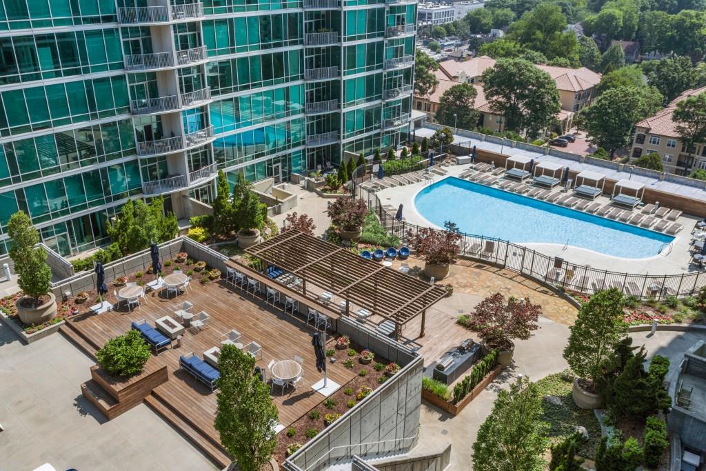 923 Peachtree Street Northeast, Unit 932 Atlanta, GA 30309 - Photo 34 of 69 an aerial view of a residential apartment building with a yard