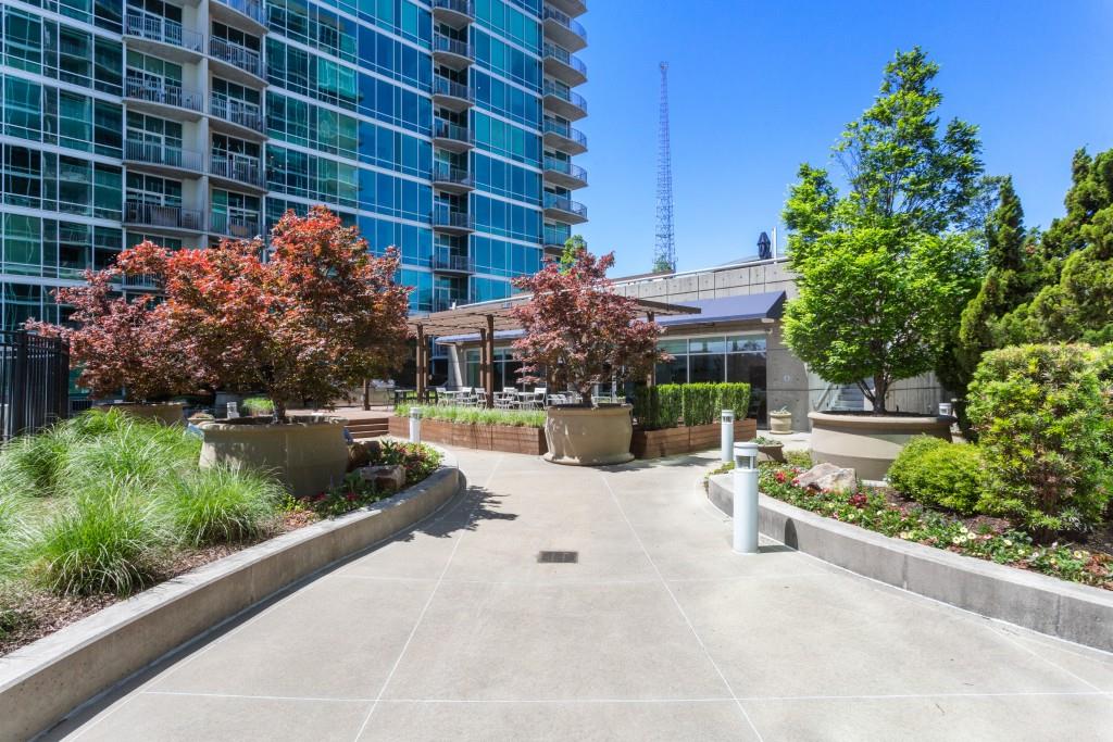 923 Peachtree Street Northeast, Unit 932 Atlanta, GA 30309 - Photo 36 of 69 a view of a building with garden and sitting area