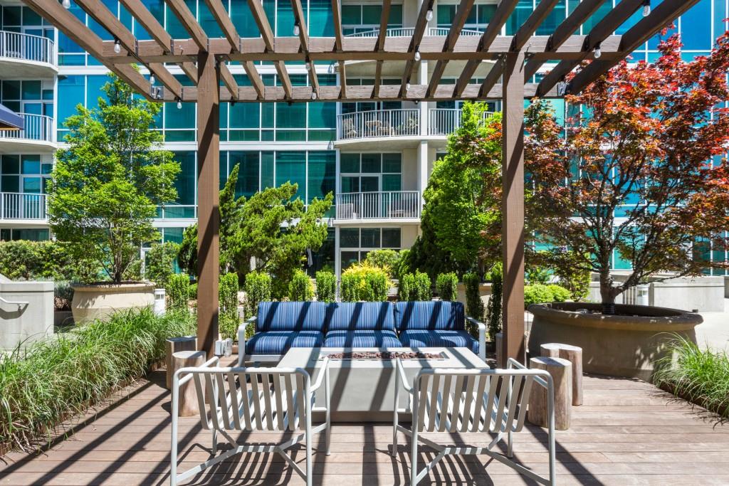 923 Peachtree Street Northeast, Unit 932 Atlanta, GA 30309 - Photo 41 of 69 a view of a chair and table in backyard of the house