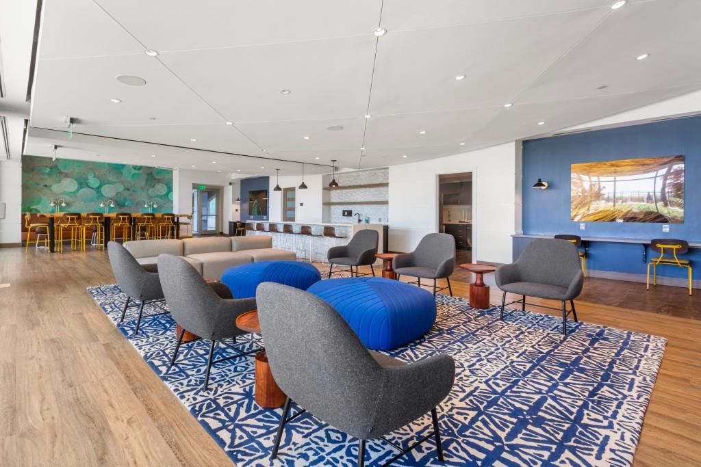 923 Peachtree Street Northeast, Unit 932 Atlanta, GA 30309 - Photo 44 of 69 a living room with furniture a rug and kitchen view