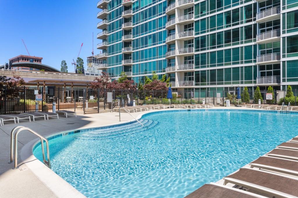 923 Peachtree Street Northeast, Unit 932 Atlanta, GA 30309 - Photo 52 of 69 a view of a swimming pool with a patio