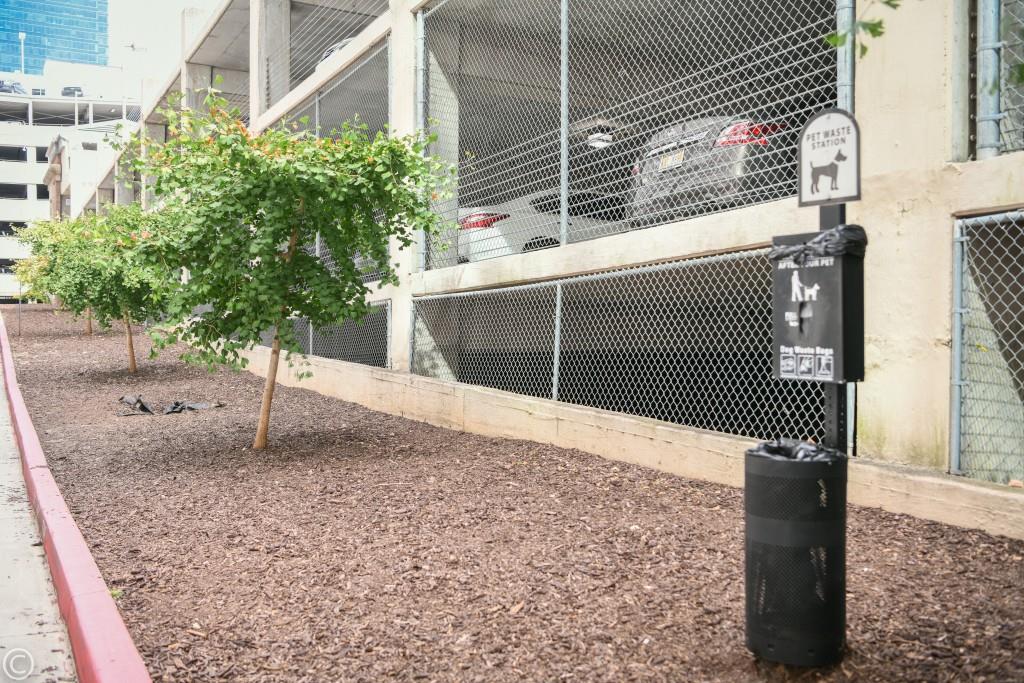 923 Peachtree Street Northeast, Unit 932 Atlanta, GA 30309 - Photo 62 of 69 a sign board with a small yard and wooden fence